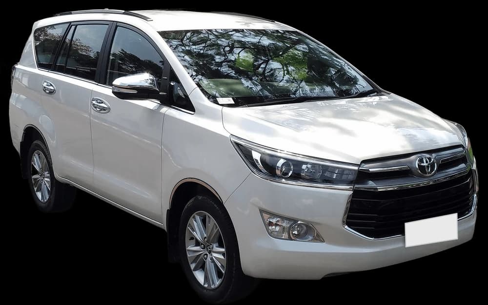 White Toyota Innova Crysta