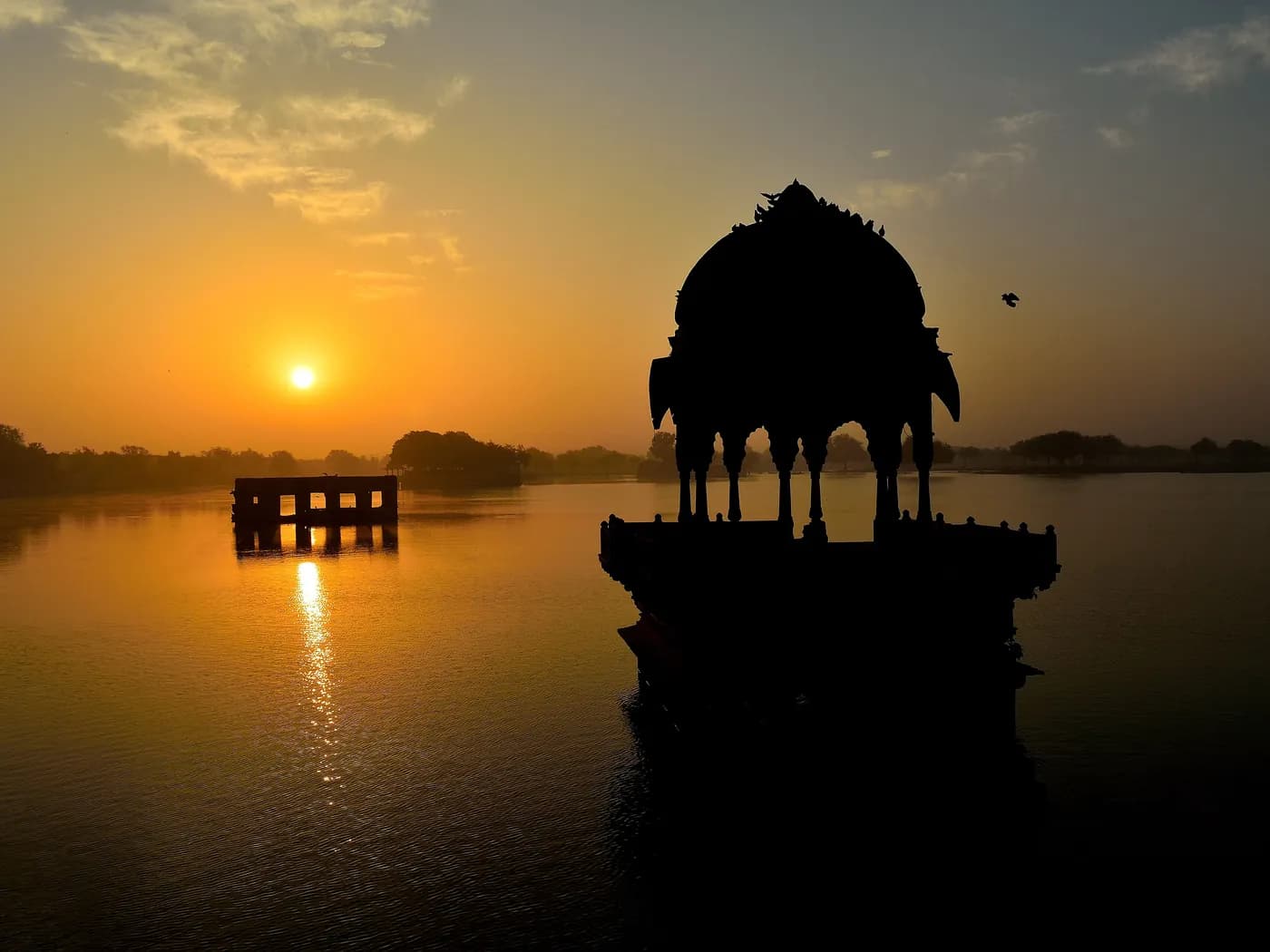 Stone ghats and domed shrines around Gadisar Lake at Jaisalmer